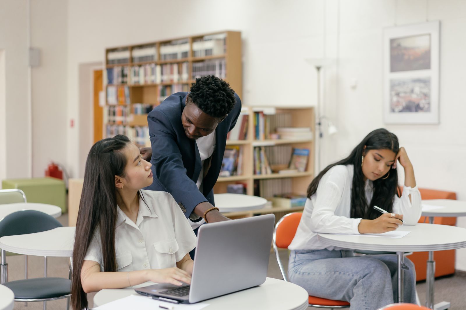 Mentor guiding students at iBORN Academy