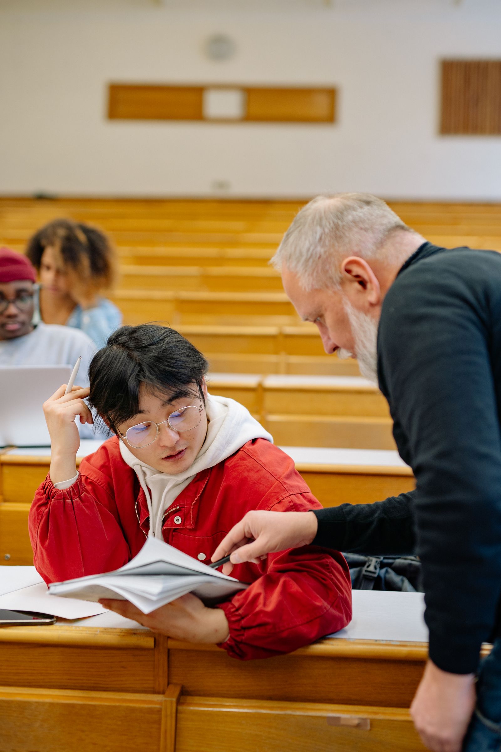 Teacher helping a student at iBORN Academy